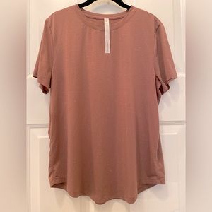 Lululemon top size 10. Color is more maroon than orange with tiny white specs.